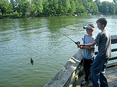 two boys fishing on the bank of Alum Creek Reservoir